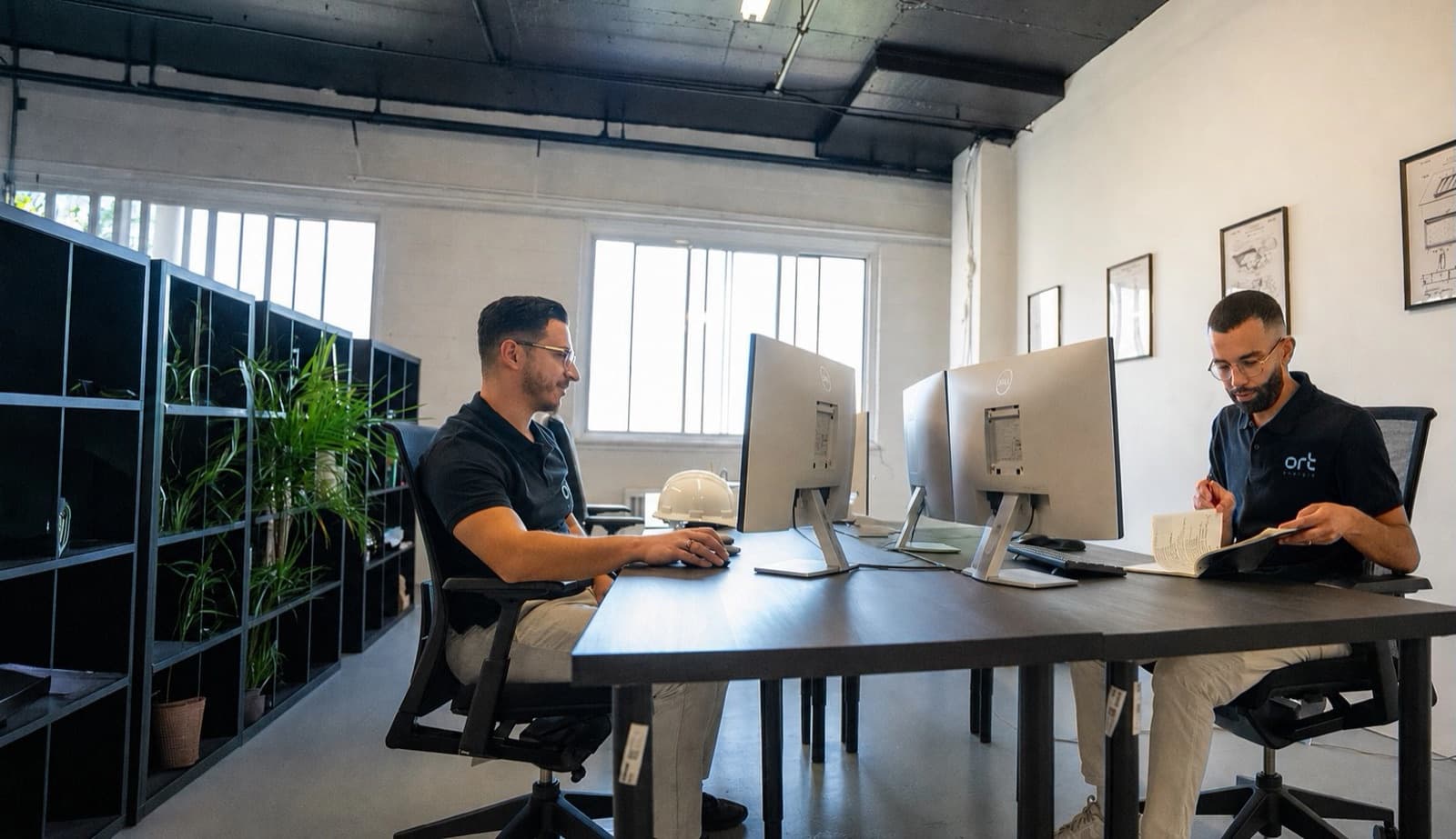 Two ORT Énergie engineers at work in the firm’s offices